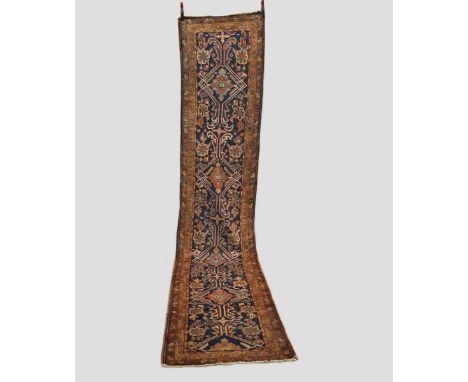 Heriz runner, north west Persia, circa 1920s, 14ft. 6in. X 2ft. 10in. 4.42m. X 0.86m. Slight wear in places; repair/repiled p