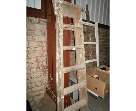 pair of wooden step ladders