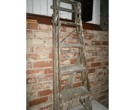 pair of wooden step ladders