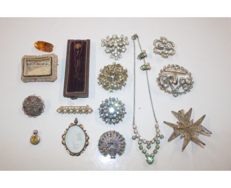 A box of jewellery including costume brooches, yellow metal stick pin etc. 