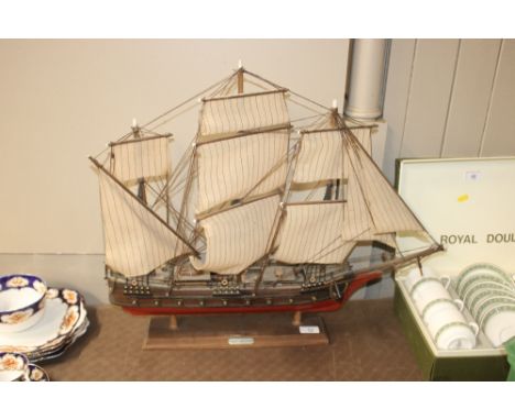 A model ship on display plinth with plaque "Frigate, XVIII Century"