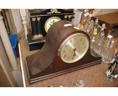A 1930's oak chiming mantel clock