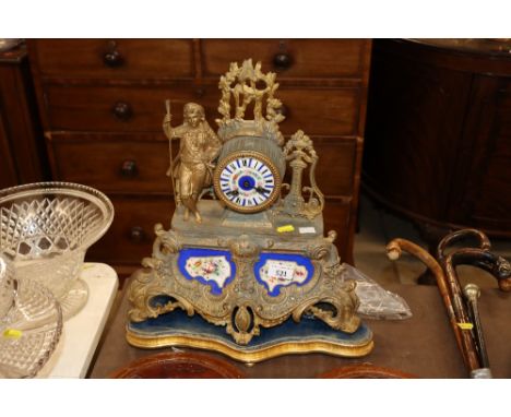 A 19th Century French gilded mantel clock with porcelain panels