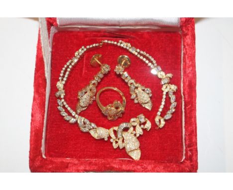 A yellow metal and diamond set jewellery set comprising ring, size K, approx. total weight 4.5gms; a pair of matching ear-rin