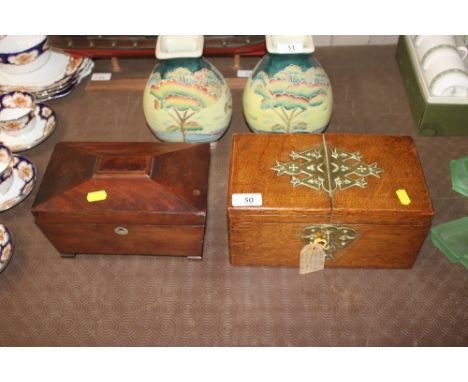A golden oak and brass mounted stationery box with Bramah lock and a mahogany sarcophagus shaped tea caddy (interior missing)