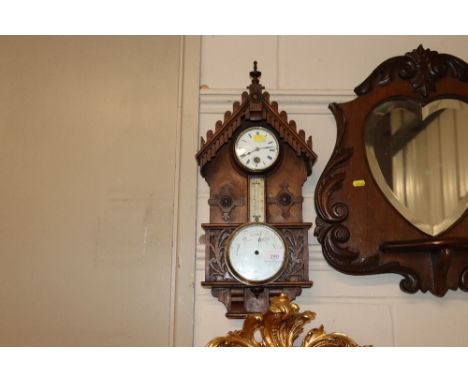 A 19th Century carved clock barometer