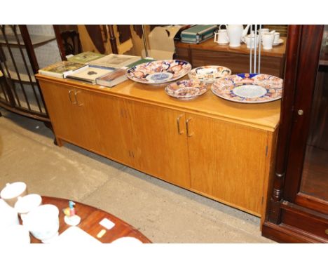 A light wood long sideboard 
