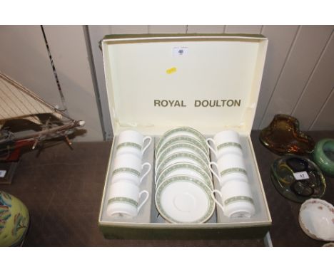 A cased set of six Royal Doulton coffee cups and saucers 