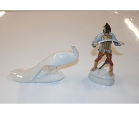 A Royal Dux stylised model of a peacock; and a Herend porcelain model of a soldier 