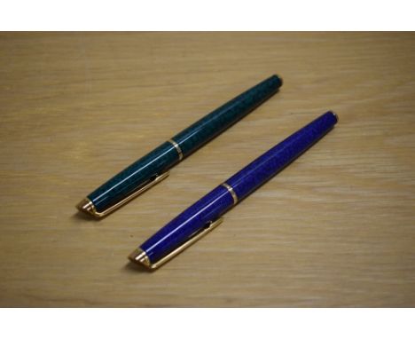 Two Waterman Hemisphere rollerball pens one in Green Marble the other Blue Marble