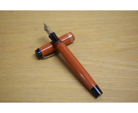 A Parker Duofold Senior button fill fountain pen in orange with two gold bands to the cap having 14K Parker England 50 nib.