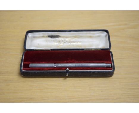 A Mabie Todd and Bard The Swan eye dropper fountain pen in engine turned silver overlay having a Mabie Todd &amp; Co New York