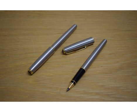 A Parker Sonnet Flighter converter fill fountain pen and rollerball pen with gold trim to the cap having a Parker nib