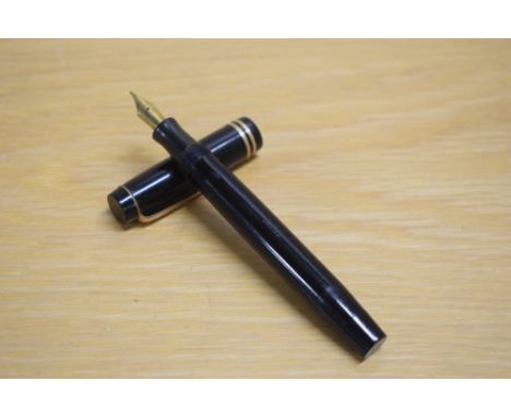A Parker Duofold Special Streamlined button fill fountain pen in black with two bands to the cap having Parker Duofold Pen Ca