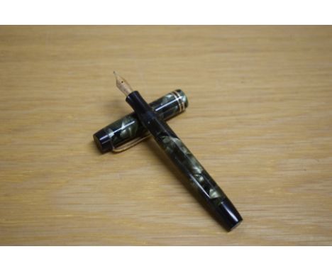 A Parker Duofold Junior Streamlined button fill fountain pen in green and black marble with two narrow gold cap bands having 