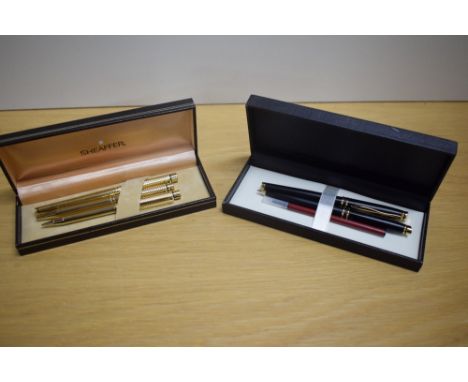 A boxed Sheaffer Targa 1005 converter fill fountain pen, ballpoint pen and propelling pencil set in gold plate finish, the fo