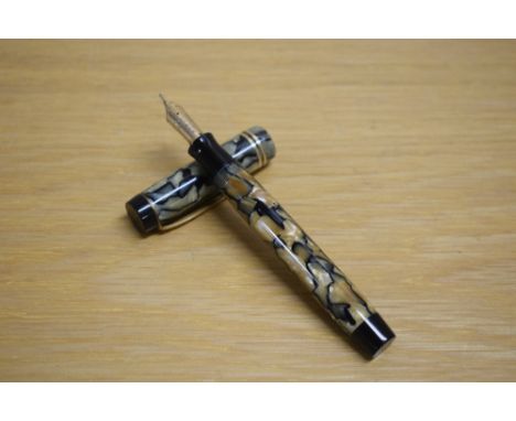 A Parker Duofold senior button fill fountain pen in pearl and black lined pattern with three narrow gold cap bands having Par