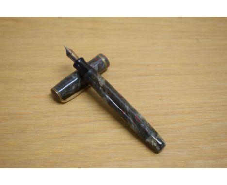 A Parker Premiere button fill fountain pen in grey marble with red specks with single gold cap band having Parker Fountain Pe