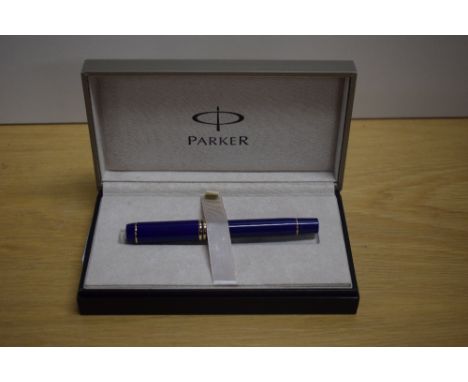 A boxed Parker Duofold Centennial converter fill fountain pen in Lapis lazulii with gold trim having Duofold Parker 18k 750 n