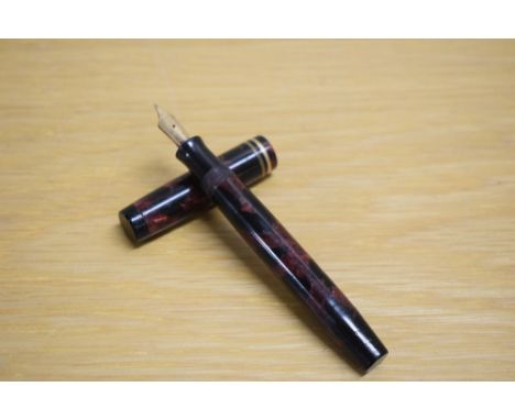 A Parker Duofold Special Streamlined Short button fill fountain pen in rose and black with two cap bands having Parker Duofol