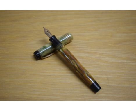 A Parker Duofold Deluxe Junior button fill fountain pen in bronze and gold with three cap bands having a Parker Duofold Delux