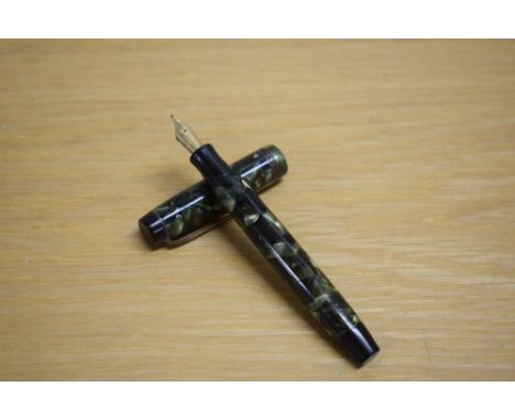 A Parker Duofold Deluxe Special Streamline button fill fountain pen in green and black marble with two cap bands having Parke