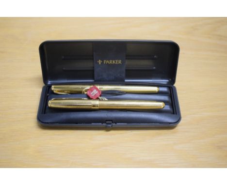 A boxed Parker Sonnet Premiere Cascade converter fill fountain pen roller ball set in gold having Parker 18K 750 nib
