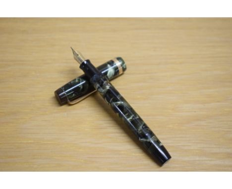 A Parker Duofold Standard button fill fountain pen in green and black marble with broad gold cap band having Parker  Duofold 