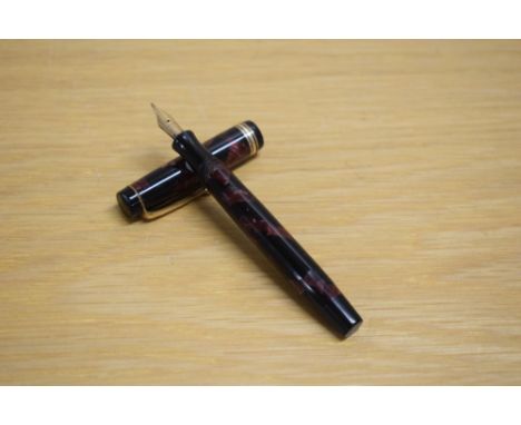 A Parker Duofold Deluxe Junior button fill fountain pen in rose and black with two narrow and one broad cap bands having Park