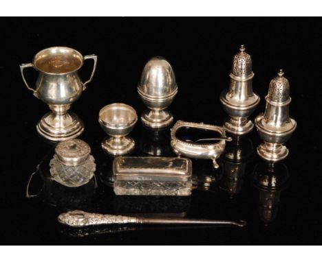 A small parcel lot of hallmarked silver items to include a cruet modelled as two eggs in egg cups, a twin handled miniature p