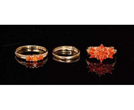 Three hallmarked 9ct dress rings, all QVC to include a fire opal three stone ring, a fire opal cluster and a pink sapphire ri