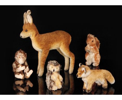 A collection of mid 20th Century toy animals in the manner of Steiff, to include a stag, hedgehog, squirrel, monkey and a fox