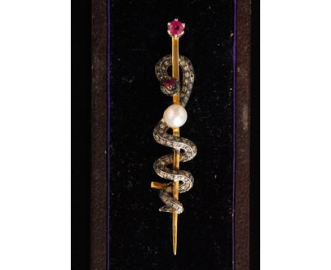 A silver gilt brooch modelled as a diamond set coiled snake detailed with rubies and a central cultured pearl, length 5.5cm. 