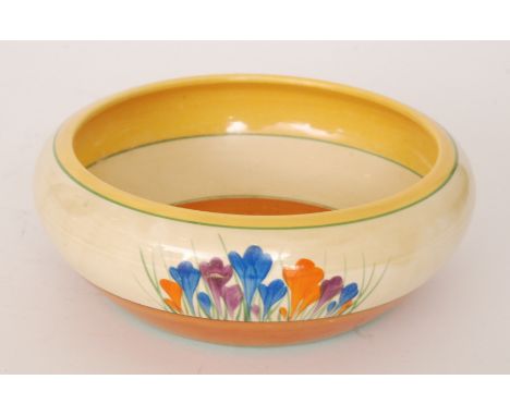 A Clarice Cliff shape 55 fruit bowl circa 1930 hand painted with sprays of crocus flowers between yellow, green and brown ban