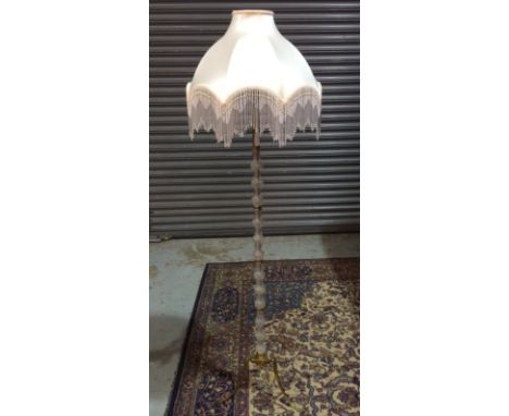 Amended description - A mid 20th Century standard lamp with a moulded glass column mounted to a brass base. 