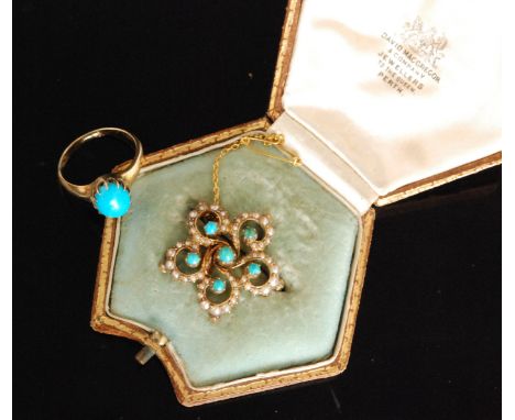 An Edwardian 15ct seed pearl and turquoise brooch designed as five seed pearl set scrolls highlighted by six turquoise caboch