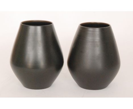 Two Poole Pottery vases of angular form decorated in a black glaze, printed marks, height 21cm, one S/D.
