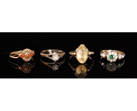 Four assorted stone set rings to include an 18ct illusion set diamond and a coral and seed pearl cluster example. (4).