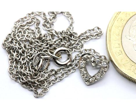 18ct white gold necklace with white gold diamond set floating heart pendant. P&amp;P Group 1 (£14+VAT for the first lot and £