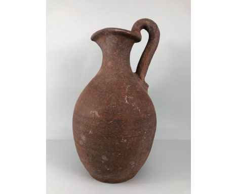 Terracotta jug, large unglazed terracotta jug in the style of a Greco Roman wine pitcher approximately 39 cm high