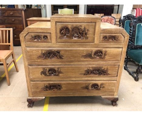 Chest of six drawers in the Oriental style, each end with carved panel, each handle carved with Oriental landscape scenes, ap