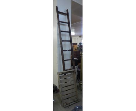 A stained pine fruit pickers ladder and a pine crate 