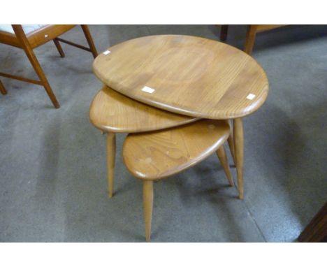 An Ercol Blonde elm and beech pebble shaped nest of tables 