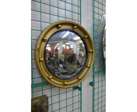A Regency style gilt framed convex mirror 