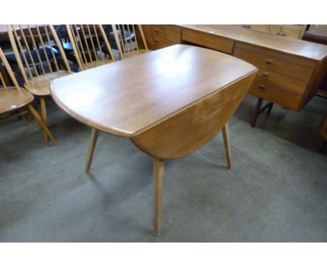 An Ercol Blonde elm and beech Windsor drop leaf table 