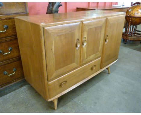An Ercol Blonde elm and beech sideboard 