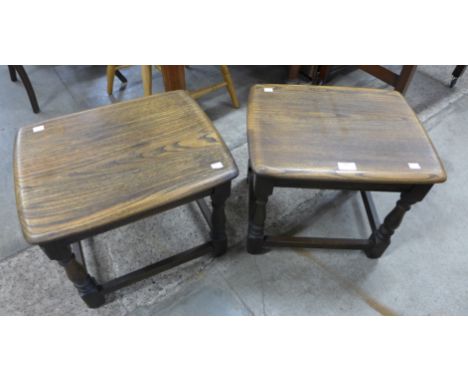 A pair of Ercol Golden Dawn elm stools 