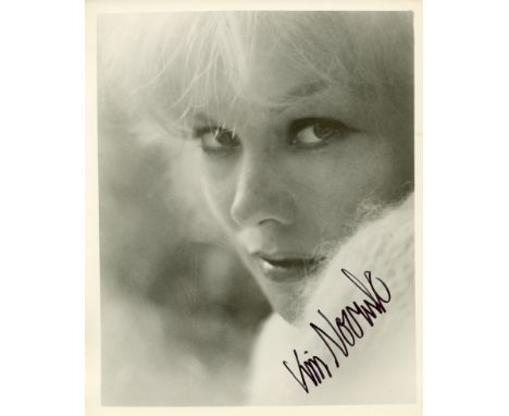 NOVAK KIM : (1933- ) American film Actress. A good and attractive signed 8 x 10 photograph by Novak, the image depicting the 