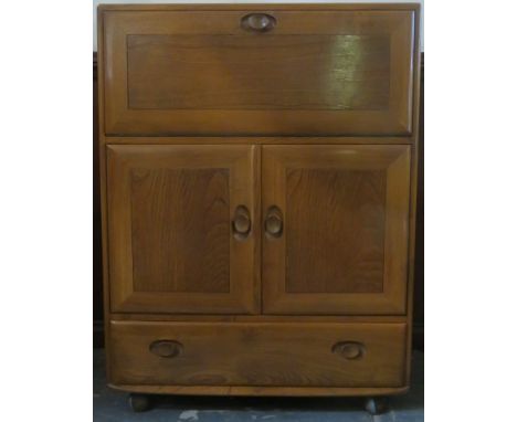 Ercol mid 20th century oak fall front writing cabinet, with fitted interior. Approx. 110cms H x 82cms W x 44cms D 