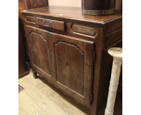 A 19th century French oak side cabinet W.134cm